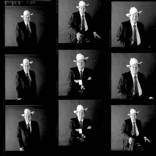 Nine vintage black and white film photos of J.B. Hunt founder in a suit and cowboy hat.