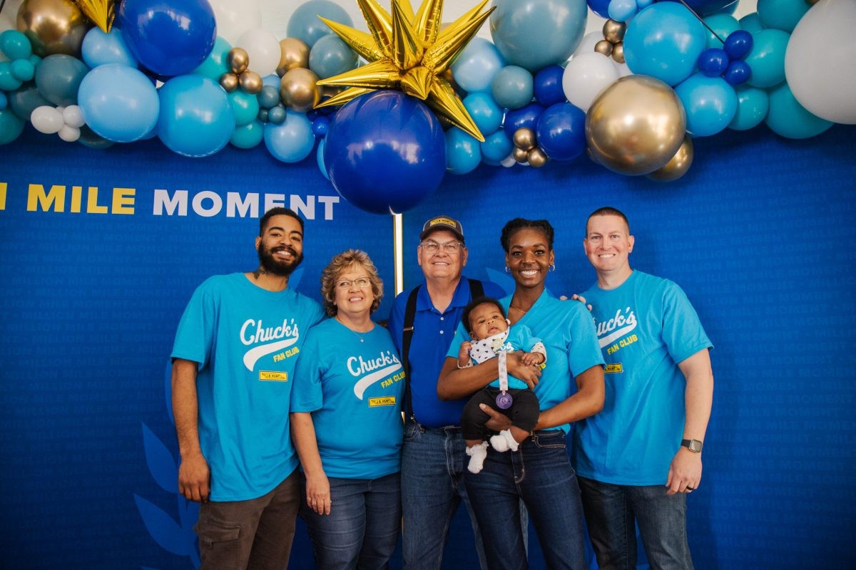 J.B. Hunt 5 million mile driver, Chuck, smiles in a photo with his family.