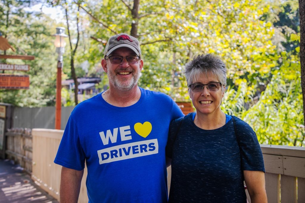 A J.B. Hunt driver with their significant other posing for a photo at a J.B. Hunt driver appreciation event.