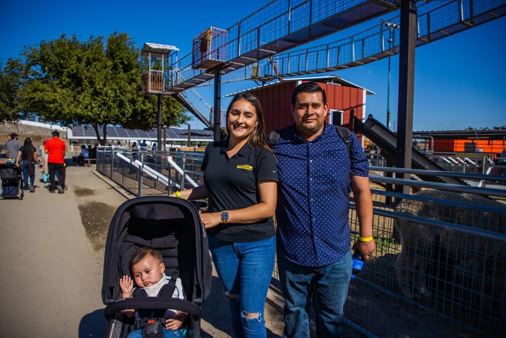 A J.B. Hunt driver and their family posing for a photo at a J.B. Hunt appreciation event.