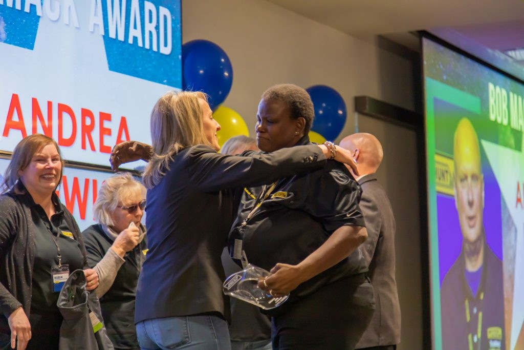 Shelley Simpson hugs a J.B. Hunt drivers during Driver Appreciation event.