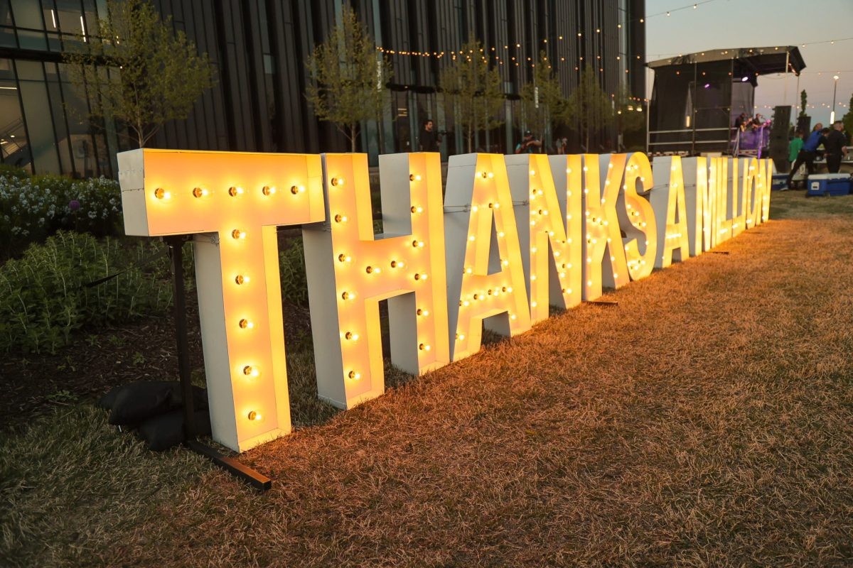 Electric lawn decorations that spell out Thanks A Million.