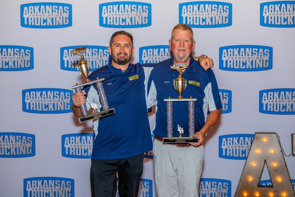 Two J.B. Hunt drivers receive awards at the Arkansas Truck Driving Championship.