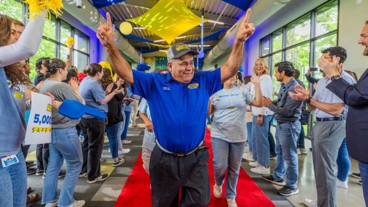 driver walks down million mile walk of fame red carpet