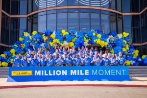 J.B. Hunt million-mile drivers stand in a group for a photo at the company corporate headquarters.