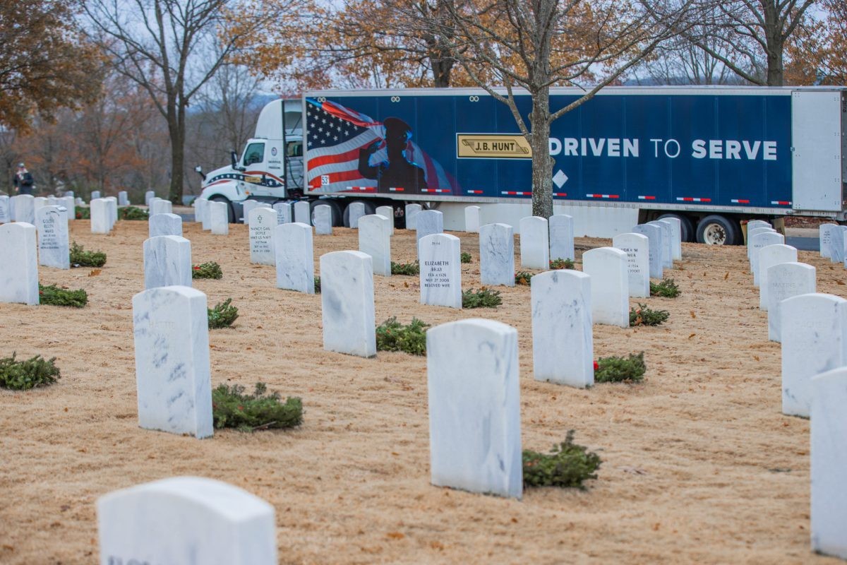 Wreaths Across America wrapped J.B. Hunt truck at national cemetery.