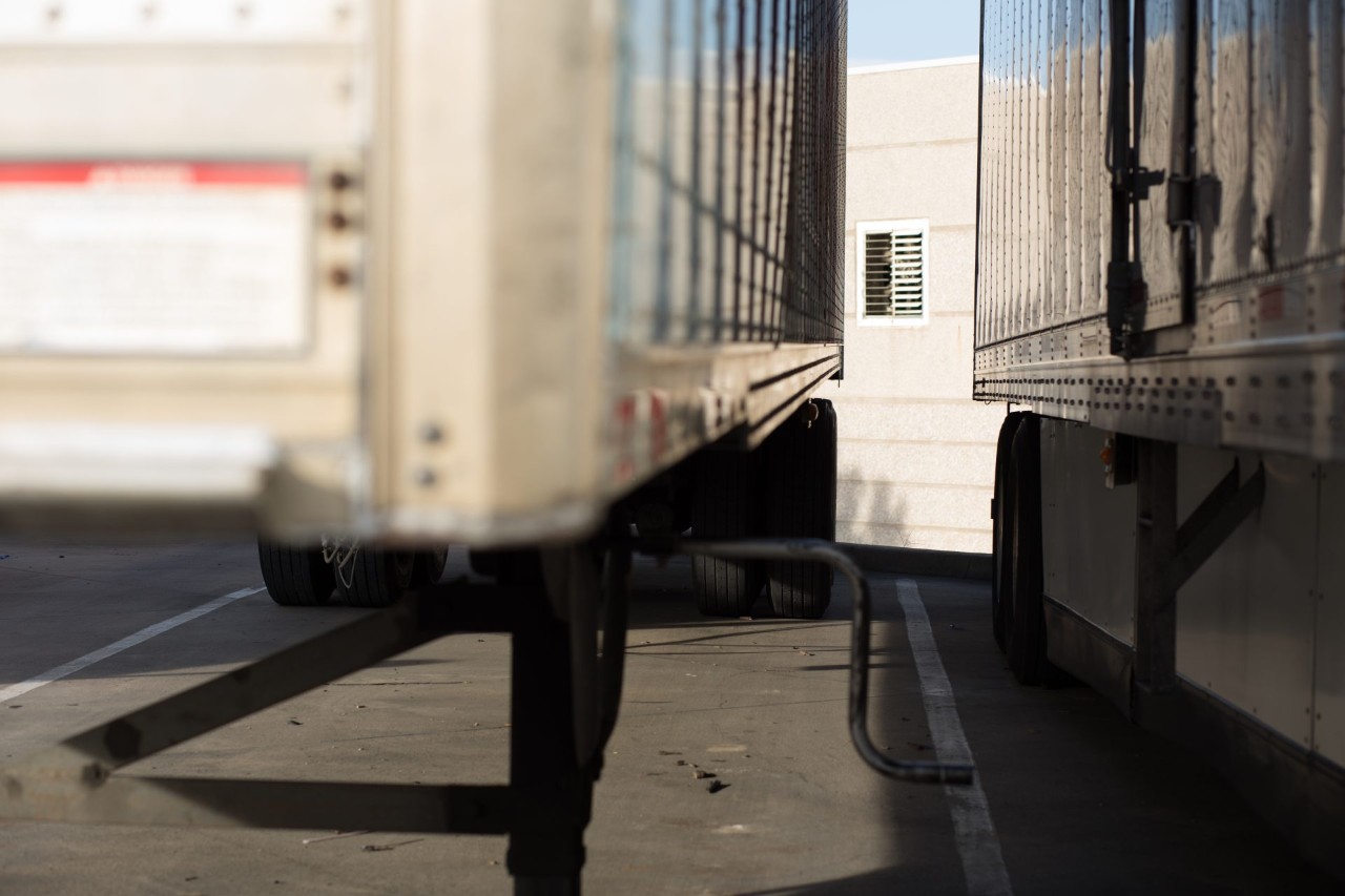 A close up picture of a walking space between two trailers.