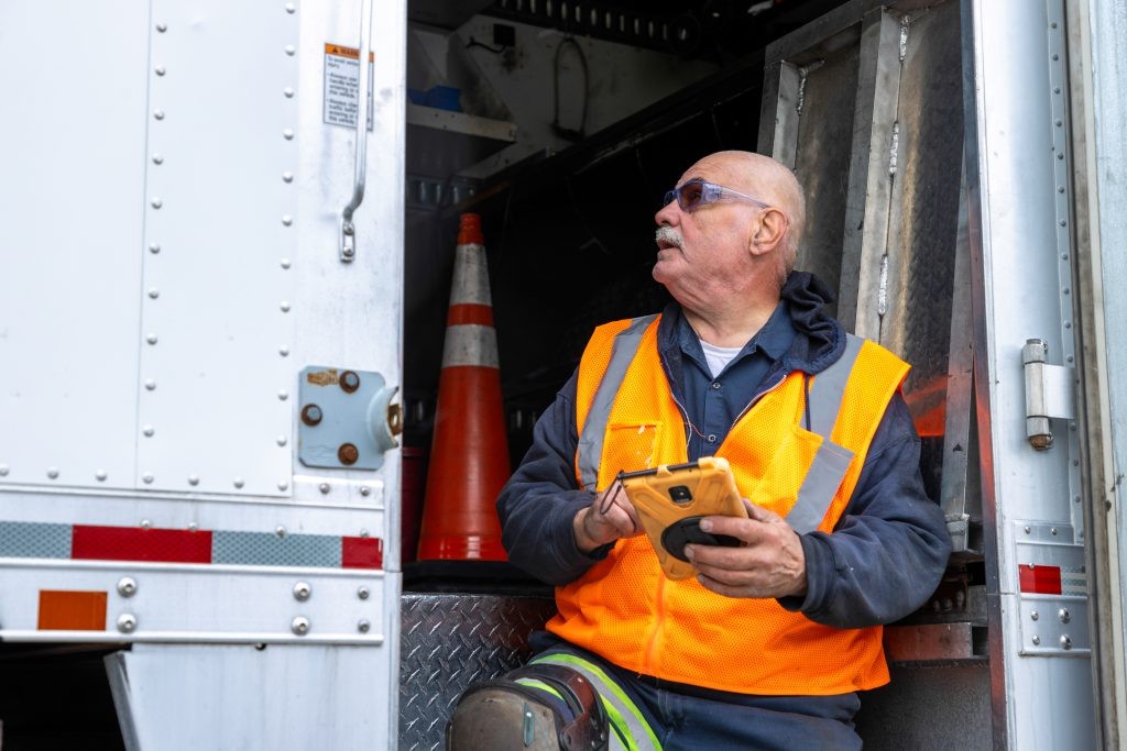Mobile technician assesses a trailer.