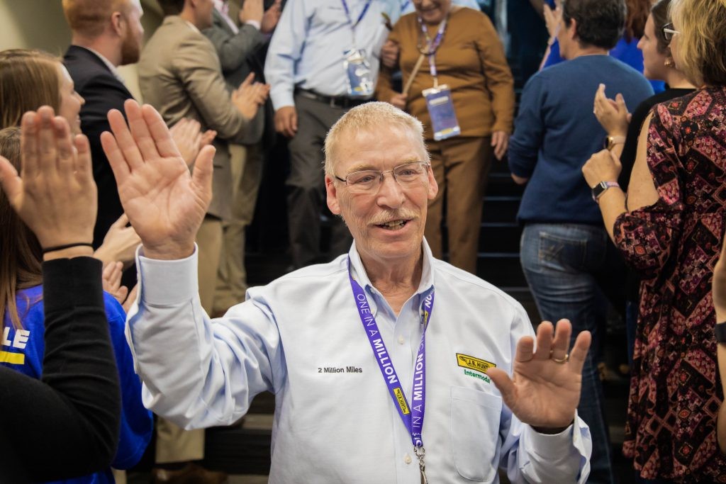 Intermodal driver Ray gives high fives as he walk the Million Mile Walk of Fame.