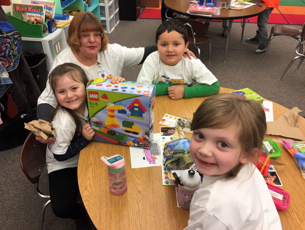 Students receive Adopt-a-Class donations. 