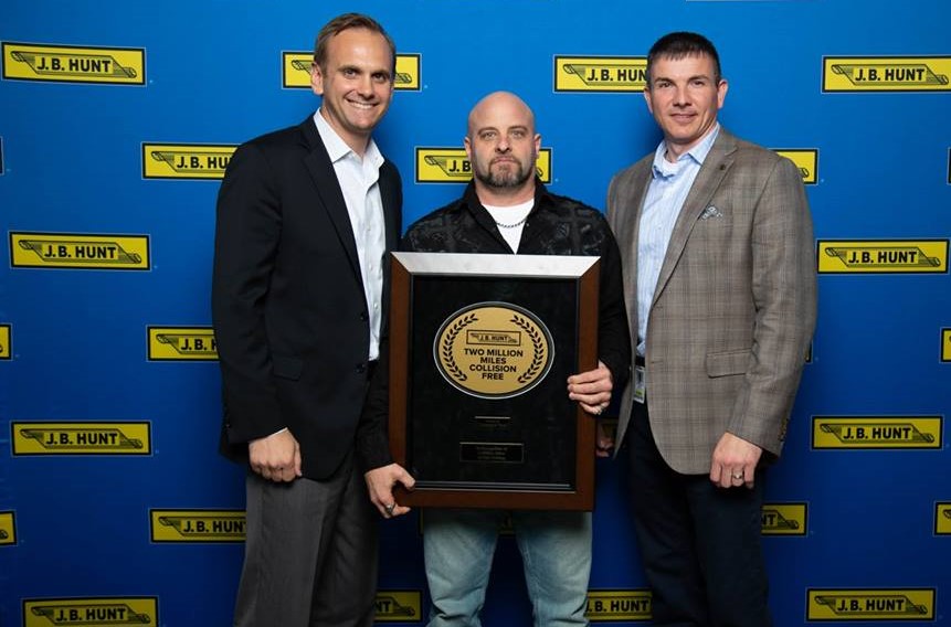 JB Hunt driver receives plaque for 2 million mile accomplishment.