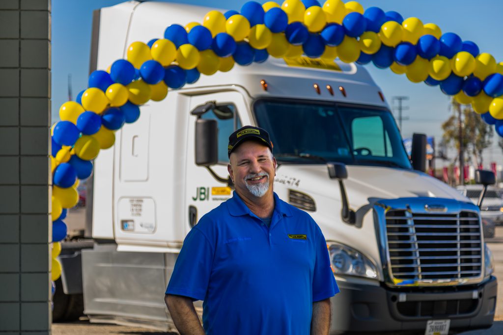 intermodal driver Phil stands in front of his sleeper cab