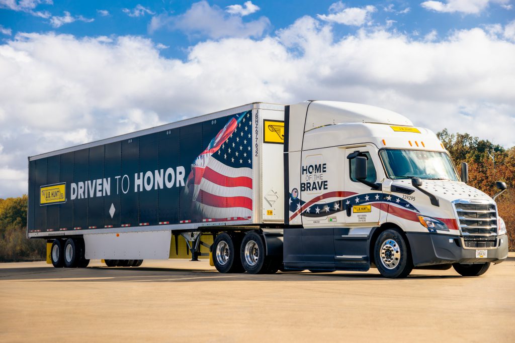 J.B. Hunt tractor trailer with military wrap.