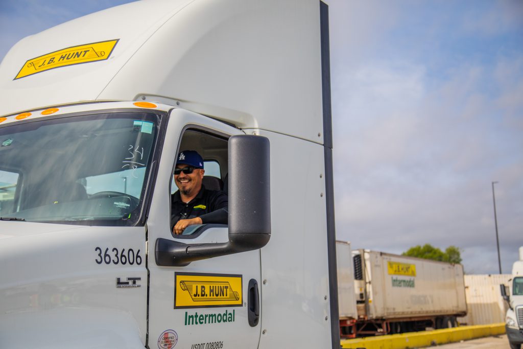J.B. Hunt driver sits in a parked intermodal day cab.