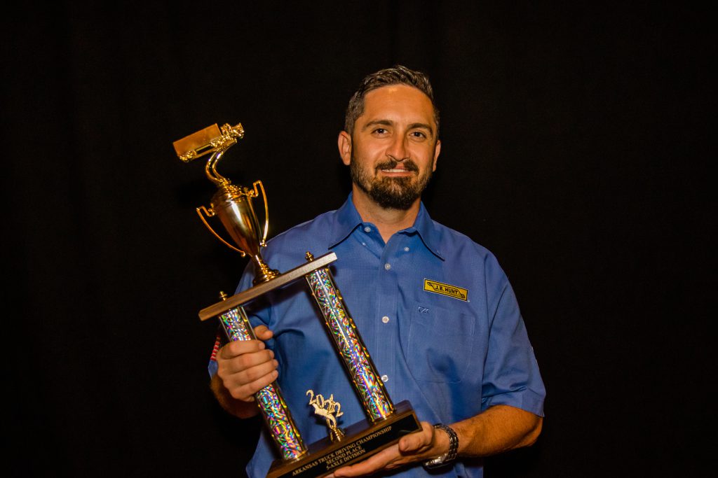 J.B. Hunt driver Chad holds his trophy for placing second in the 5-Axle Division.