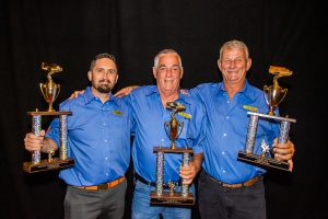 J.B. Hunt drivers Chad, Dale and Darrell stand together with their trophies.