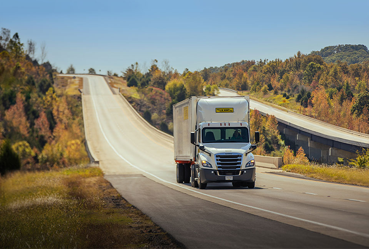 J.B. Hunt tractor trailer on a highway during fall