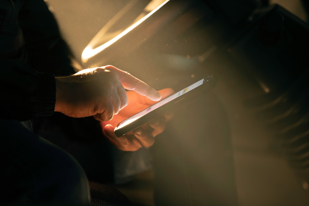 Driver using DRIVE app in truck cabin