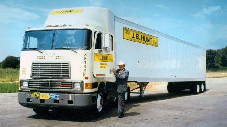 historic photo of mr. hunt posing with truck